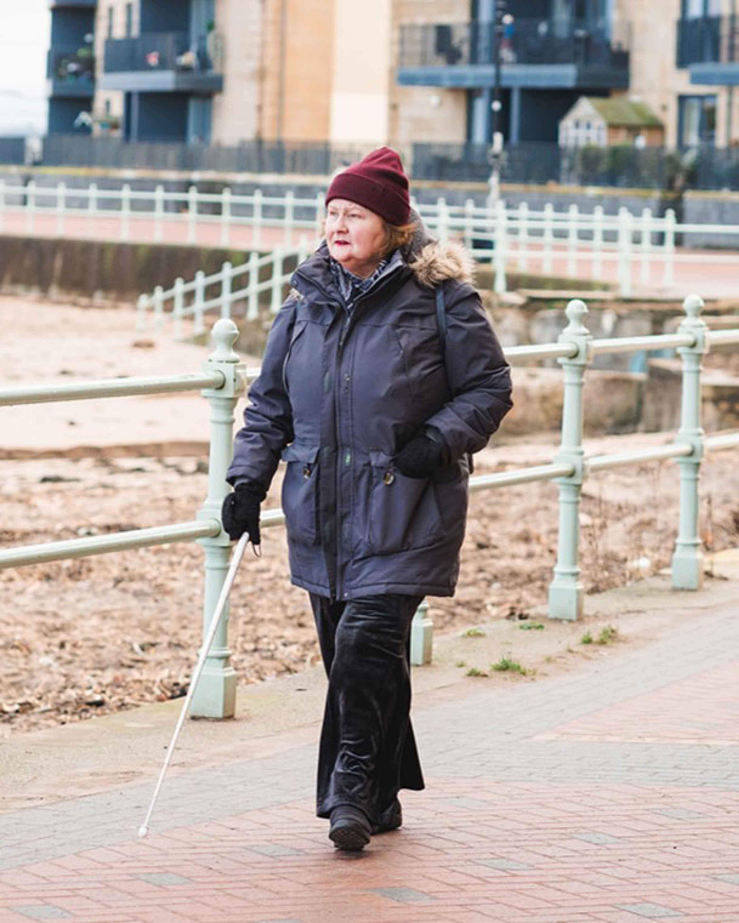 Anne walking by the beach