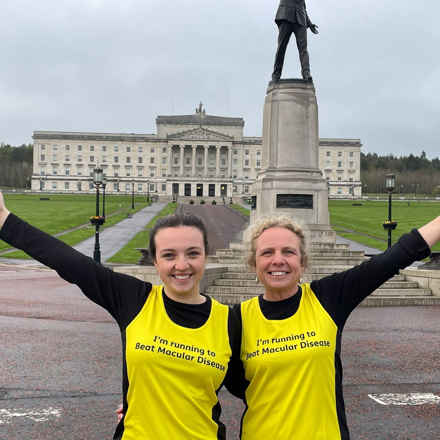 Claire and Patricia prepare for the Belfast Marathon 2022 in front of building