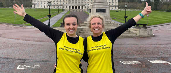 Claire and Patricia prepare for the Belfast Marathon 2022 in front of building