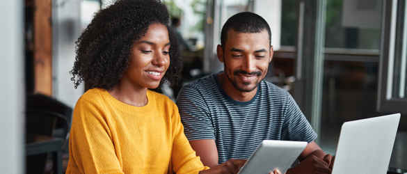 couple looking at a tablet together