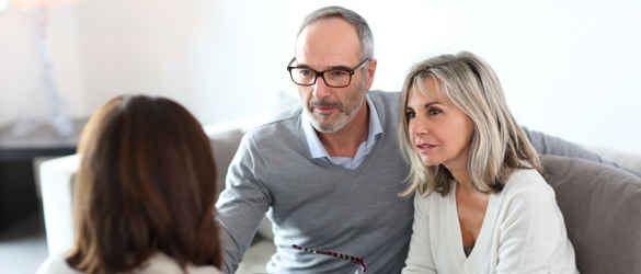 Couple having a discussion with a funeral director