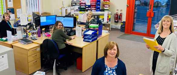supporter care group photo in office