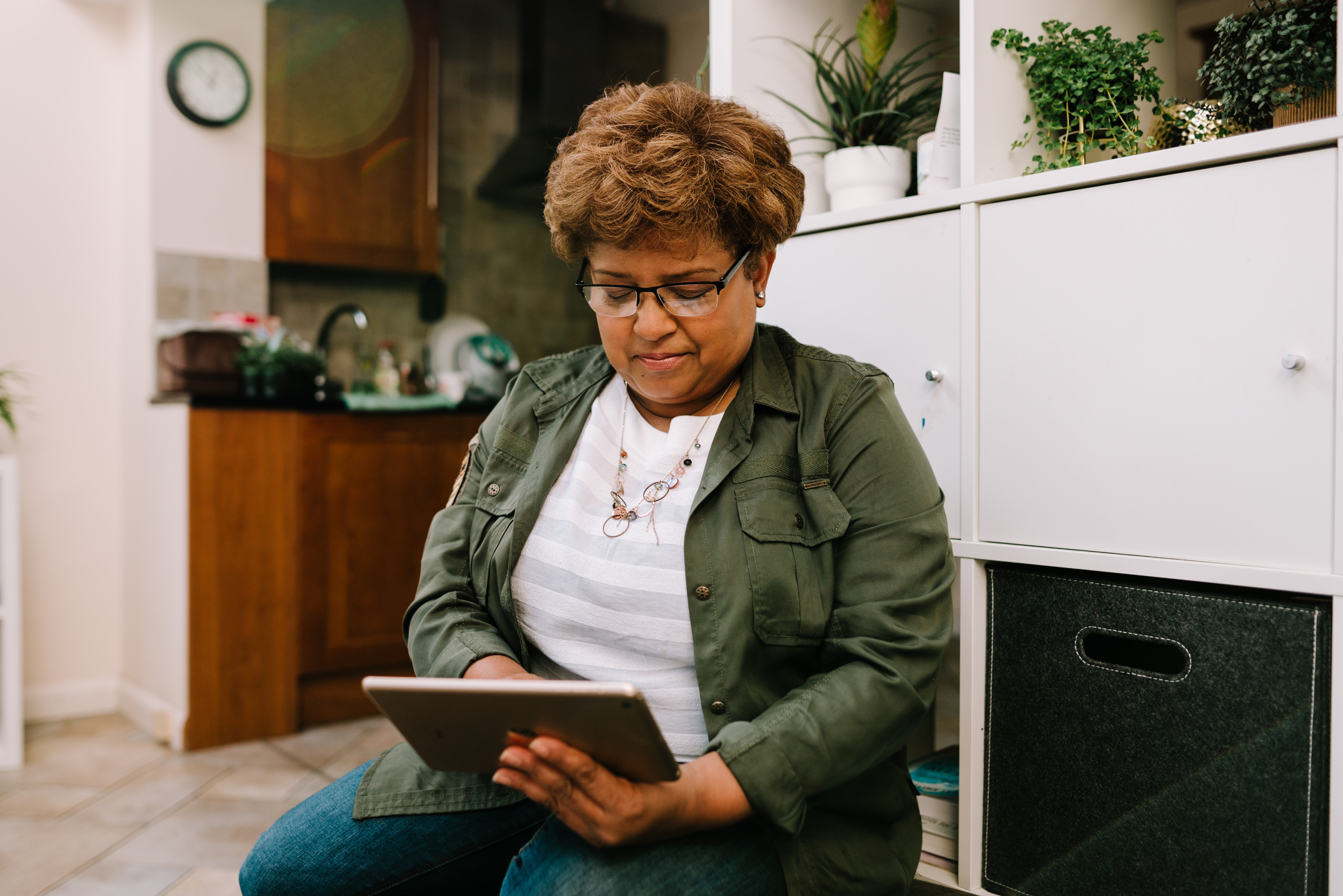 Lady looking down at tablet
