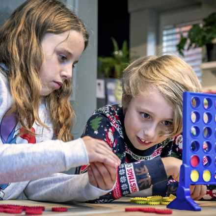 Farrah and George playing connect four