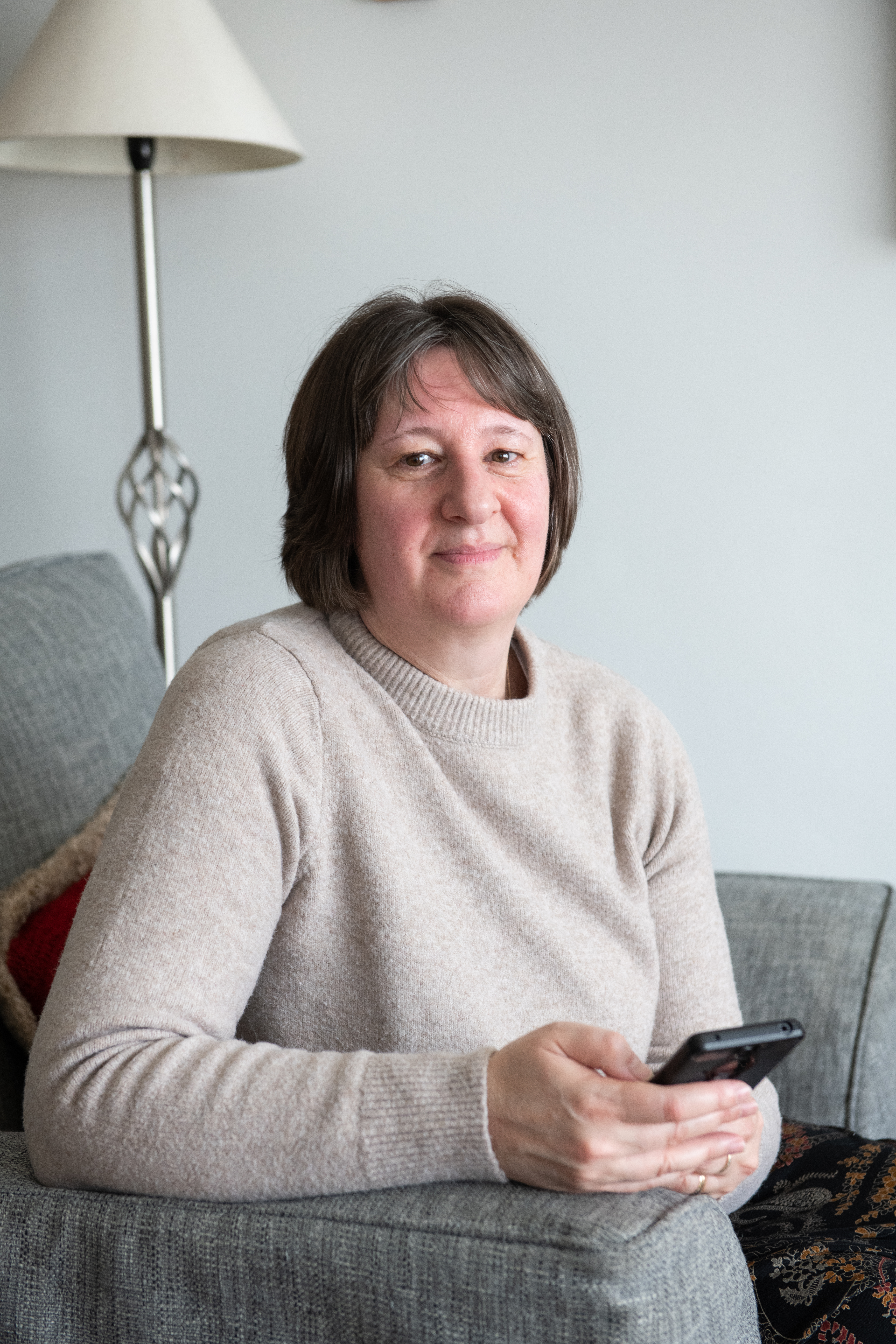 Nancy smiling and looking into the camera