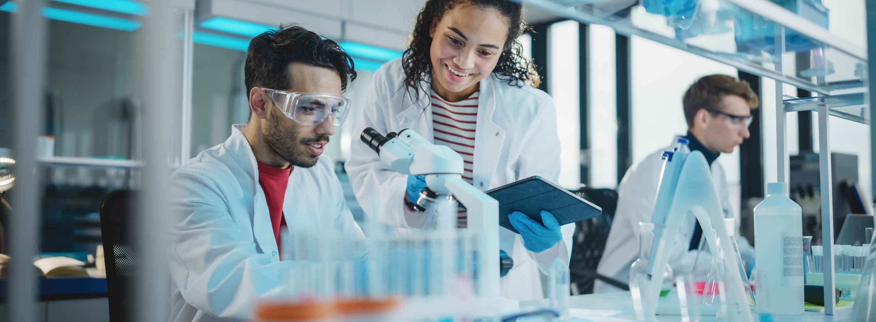 Research image of three technicians in a laboratory 